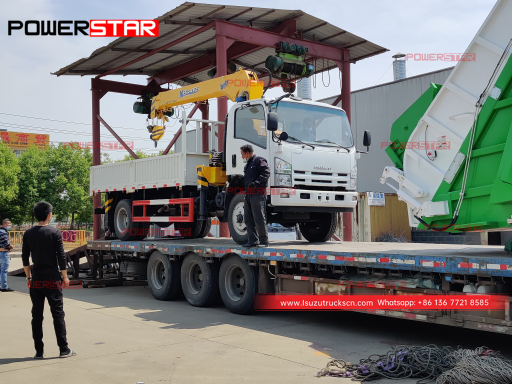 Mongolia ISUZU FTR/FVR refuse compactor truck at NPR boom crane truck